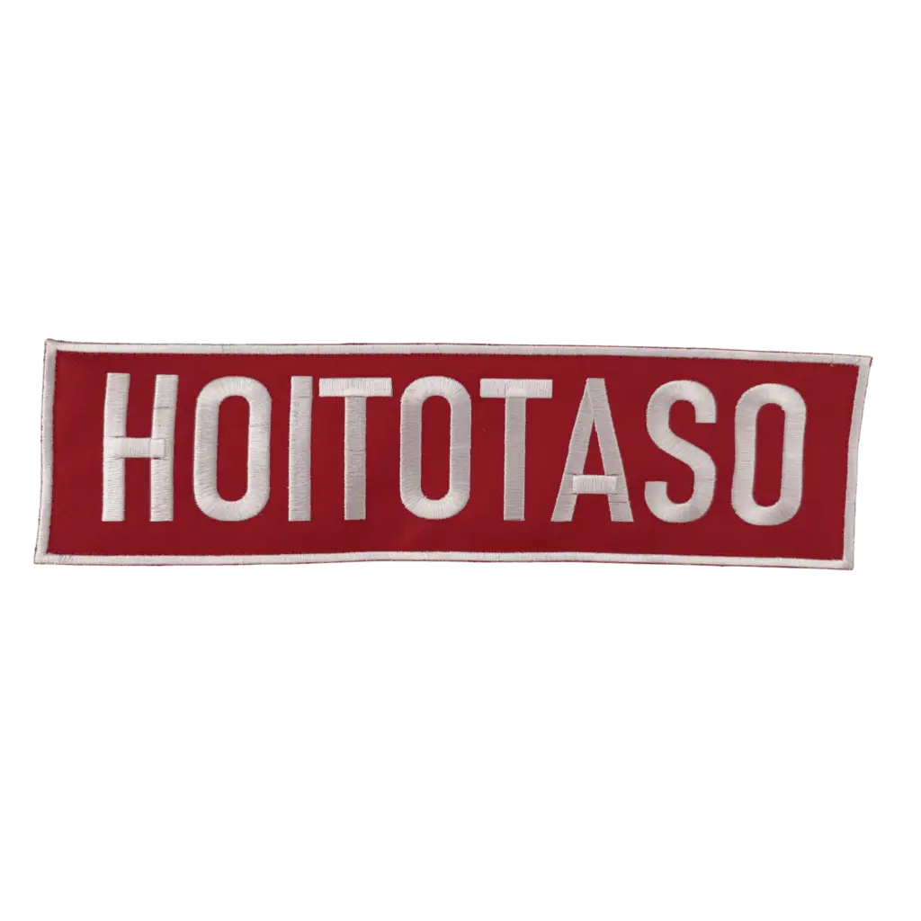 HOITOTASO Selkäkyltti - Brodeerattu