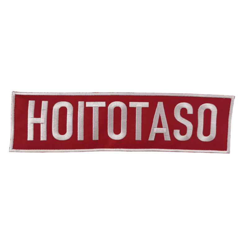 HOITOTASO Selkäkyltti - Brodeerattu