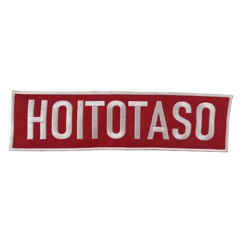 HOITOTASO Selkäkyltti - Brodeerattu